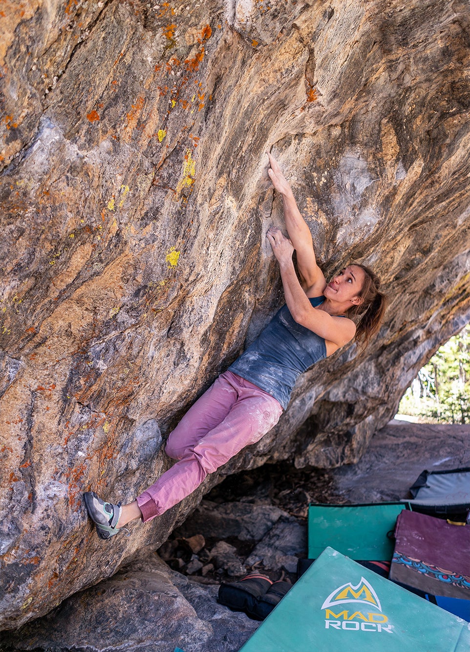Tim Kemple, Sr., replaces hardware on a route at the Parking Lot Wall at Rumney, New Hampshire. Photo by Bob DeSebastian