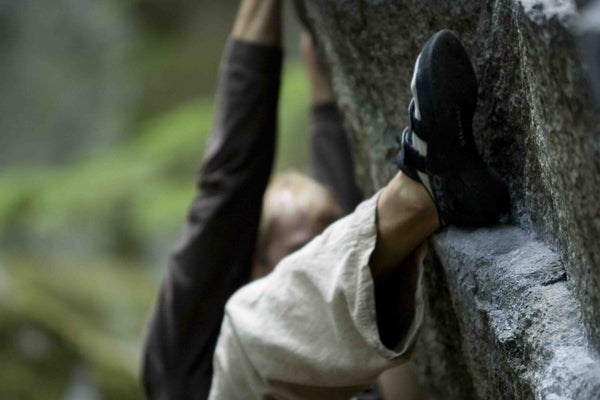 Lee Sheftel coming out of the lower cave on Simply Read (5.13d), Project Wall. Photo by Celin Serbo — serbophoto.com.