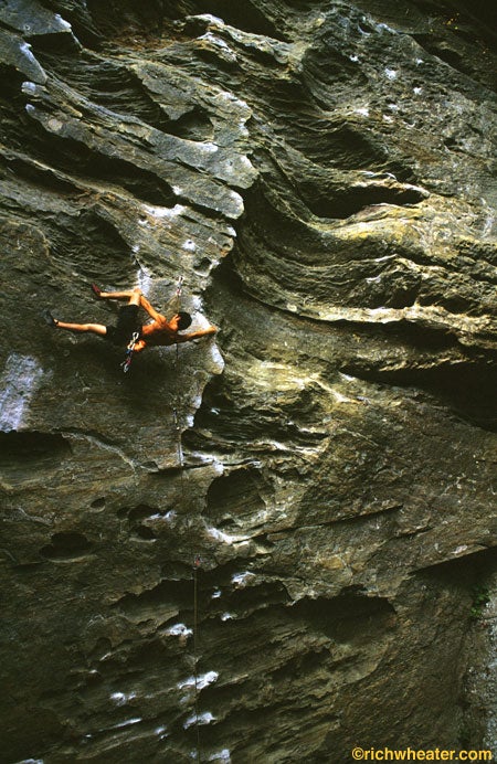 Julie Ellison avoids the spray on a cold day for Grace's Buckets (5.11d), Little River Canyon, Alabama. Photo: Andrew Burr