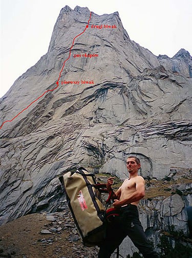 Adam Pustelnik poses under the face cli Adam Pustelnik poses under the face climbed by Amba (VI 5.12d/13a) in Kyrgyzstan. See http://www.wspinanie.pl/serwis/200609/13ak-su_amba_en.php for…