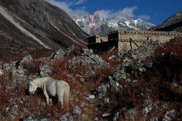 New Routes in China’s Genyen Mass New Routes in China’s Genyen Massif