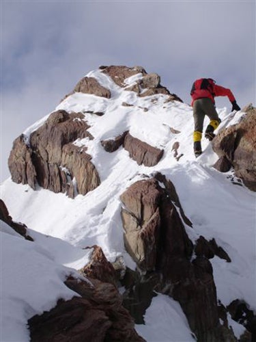 Jed Brown reaching the summit of Mt. Sl Jed Brown reaching the summit of Mt. Slaughter for the second ascent.