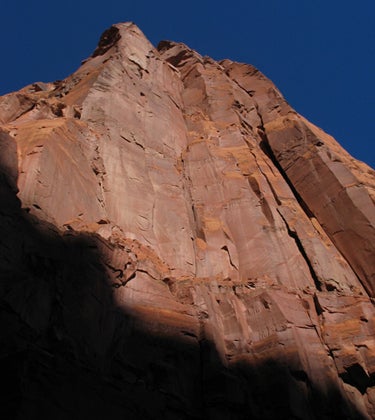 More Sand Than Stone takes the central More Sand Than Stone takes the central dihedral line, then cuts left to the arête. This photo shows only the lower half of Tooth Rock’s…