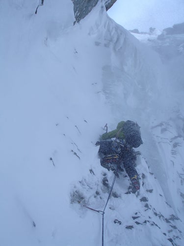 Houseman battles toward the couloir&rsq Houseman battles toward the couloir’s crux overhanging ice on the first day of climbing.