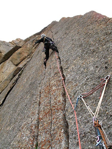 Anne Arran launching up the 5.11+ crack Anne Arran launching up the 5.11+ cracks of pitch 14 on Bloody Mary. The belay bolts were placed by the first-ascent party three years ago.