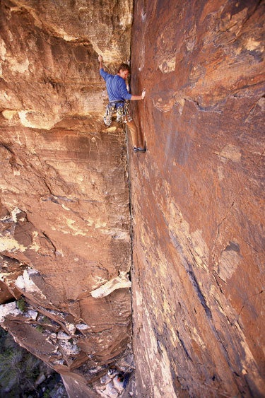 Joel Dashnaw finds his own personal Veg Joel Dashnaw finds his own personal Vegas on the third pitch of Dark Shadows, Pine Creek Canyon, Red Rocks, Nevada.