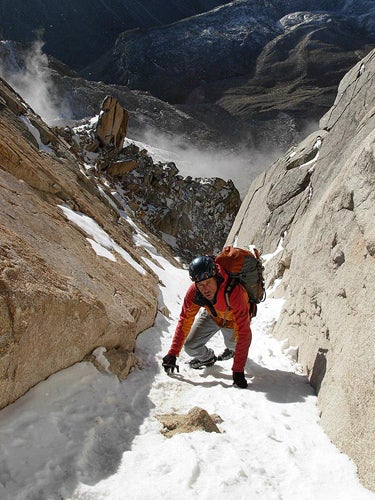 Peter Inglis climbs the initial couloir Peter Inglis climbs the initial couloir on Peak 5,965m, west of 6,204-meter Mt. Genyen. Photo by Joseph Puryear.
