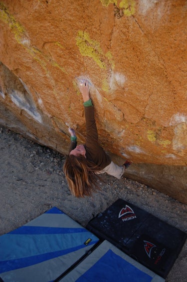 Kelly McBride hangs on to Center Direct Kelly McBride hangs on to Center Direct (V10) at the Peabodies during her send. Photo by Jeff Sillcox.