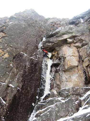Will Mayo leads the striking first pitc Will Mayo leads the striking first pitch of Mean Streak (WI6 M7) on Cannon Cliff. Photo by Andy Tuthill.