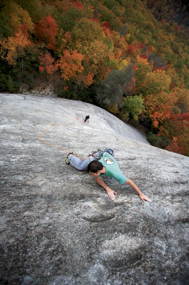 Eyebrow hunter Chris Van Leuven scopes Eyebrow hunter Chris Van Leuven scopes for gear on P2, The Nose (5.8), Looking Glass Rock, North Carolina.