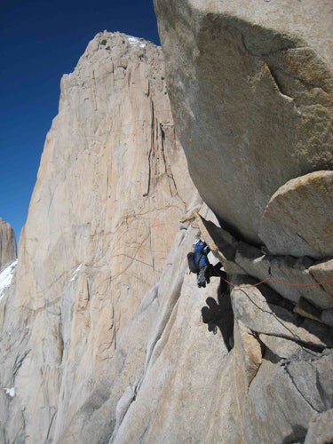 Freddie Wilkinson leads the way from Ag Freddie Wilkinson leads the way from Aguja Mermoz to Fitz Roy, whose enormous bulk fills the background. Photo by Dana Drummond, courtesy of Freddie…