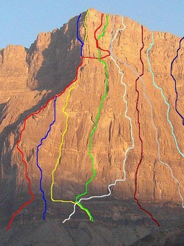 Selected routes on the 900-meter southe Selected routes on the 900-meter southeast face of Jebel Misht: French Pillar, 5.10, 1979 (red); Make Love Not War, 5.12b sport, 2003 (green); Yel-la…