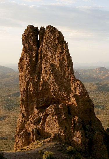 Laurel Burr leads the crux pitch of Raz Laurel Burr leads the crux pitch of Razor’s Edge (II 5.6), Superstition Mountains, Arizona, while Jeffro Snyder belays from Chicken Ledge.…