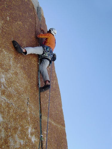 Thom Engelbach leads a short splitter o Thom Engelbach leads a short splitter on Avelani Avenue (V 5.11-R A0) on South Avellano Tower, Chile. Photo by Jim Donini.