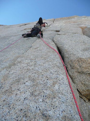 Toby Grohne leads pitch 5’s fist Toby Grohne leads pitch 5’s fist crack, above the dike traverse. Photo by Jesse Huey.