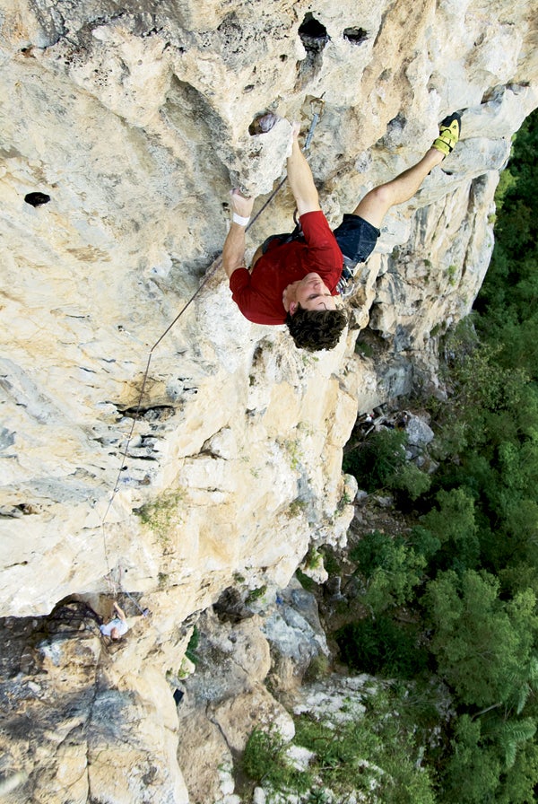 Dave Barnett clutching a stalactite on Dave Barnett clutching a stalactite on p2 of Mucho Pumpito, viñales valley, Cuba. Photo by Jimmy Chin.