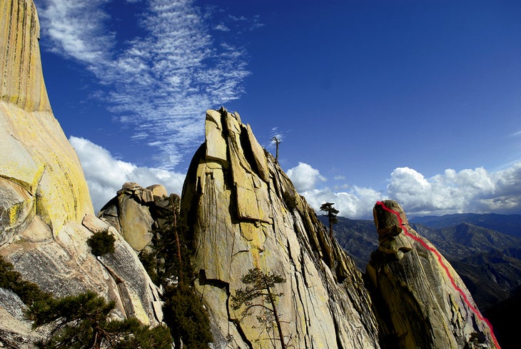 The super-scenic Wizard Needle's summit The super-scenic Wizard Needle's summit. Yellow Brick Road follows the red line shown in this image. Photo by James Q Martin / jamesqmartin.com