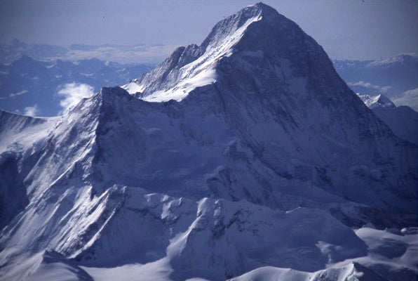 Makalu from the northwest. The route cl Makalu from the northwest. The route climbs the shaded snow and ice slopes to the saddle in center (Makalu La, 7,400m), and then follows the sunlit…