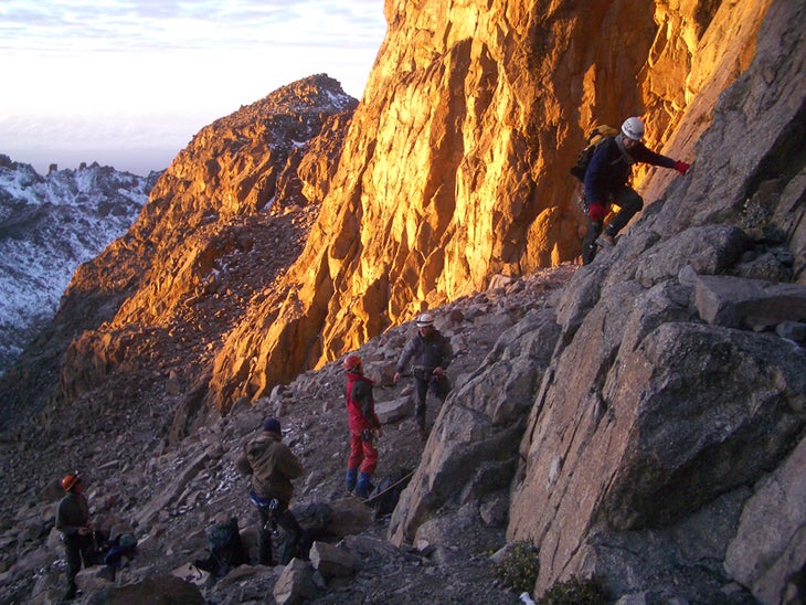 Early morning light and climbers at the Early morning light and climbers at the start of the normal route to the Nelion. Felix Berg / Summitclimb.de