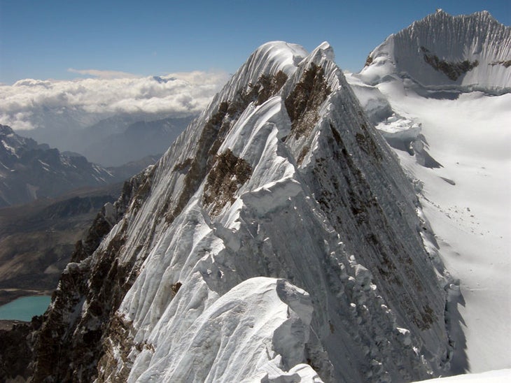 The corniced ridge between Jobo Rinjang The corniced ridge between Jobo Rinjang and the main summits of the Lunag massif. The two climbers spent a full day trying to negotiate the ridge,…