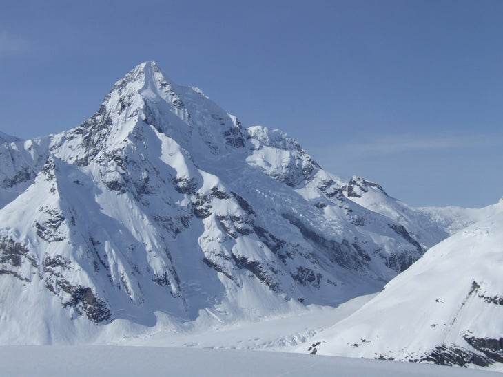 The north and east faces of Peak 8,599' The north and east faces of Peak 8,599' (“Fifty Years of Alaskan Statehood”). Knott and McKinnon made the first ascent of this beautiful…