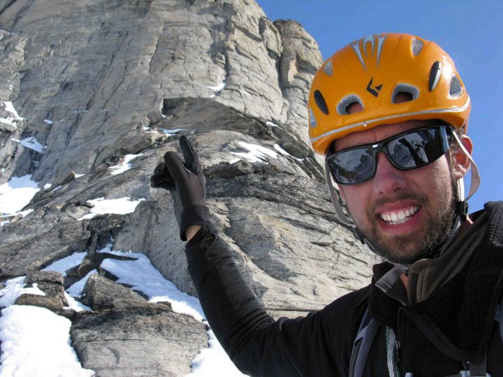 Dave Turner pauses below the seven-pitc Dave Turner pauses below the seven-pitch headwall on the north face of Broad Peak on Baffin Island. Turner completed a single-push first ascent of…