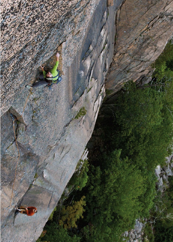 Heather Murray on P2 of Sea Gypsy (II 5 Heather Murray on P2 of Sea Gypsy (II 5.9+ R), Acadia National Park, Maine, moving into slammer jams above the route’s friction crux. Photo by…