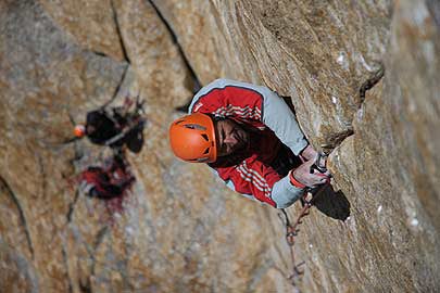 Huber climbs the 5.13a crux of Eternal Huber climbs the 5.13a crux of Eternal Flame, an overhanging finger crack at around 20,000 feet. Photo by Fritz Hinderbrandner / Huberbuam.de.