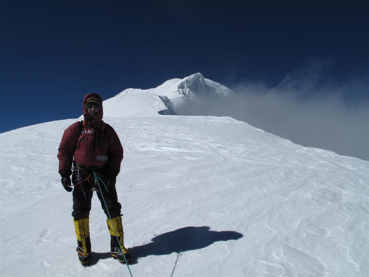 Tromsdorff at the duo’s circa 7,000-met Tromsdorff at the duo’s circa 7,000-meter high point on Nemjung, with a view to the 7,140-meter summit in the distance. Photo by Yannick Graziani.