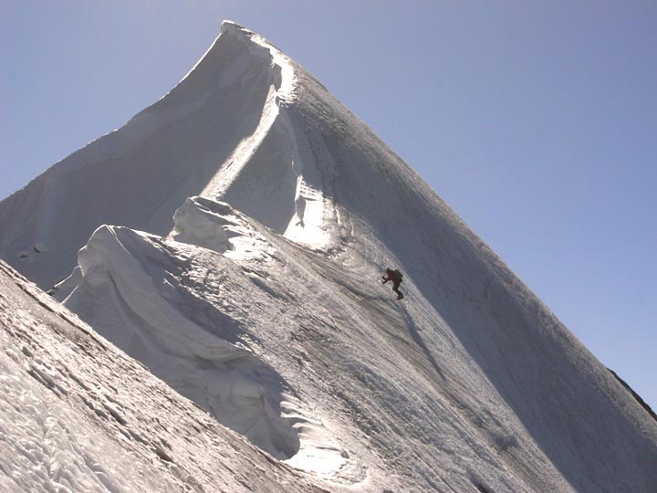 Martin Ploug traversing along the north Martin Ploug traversing along the north ridge. To the right is the icy west face, down which Ploug fell 30 meters during the pair’s descent. He…
