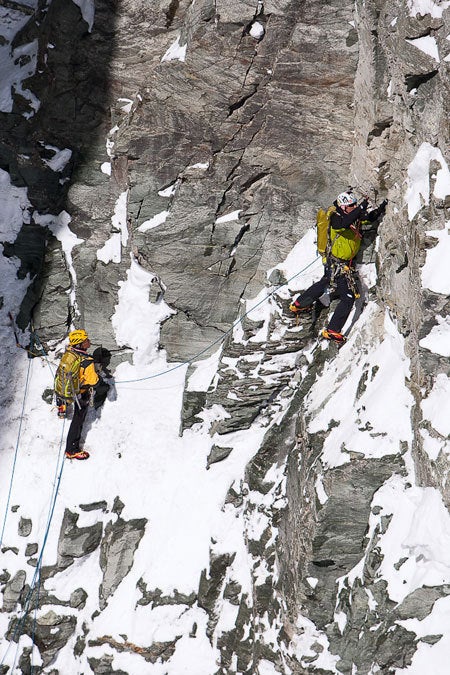 Typical climbing on the new route: Loos Typical climbing on the new route: Loose snow over compact rock. Hervé Barmasse leading, belayed by his father, Marco. Photo by Damiano Levati…