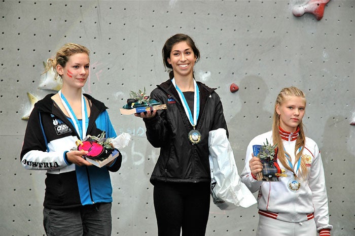 Dana Riddle stands atop the podium with Dana Riddle stands atop the podium with a gold medal, followed by Austria's Alexandra Elmer and Russia's Valeria Baranova. Photo by Larry Riddle