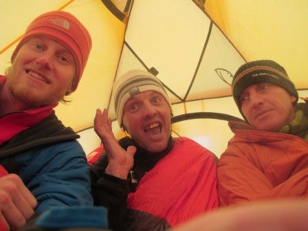 From left: Cory Richards, Simone Moro, From left: Cory Richards, Simone Moro, and Denis Urubko at base camp below Gasherbrum II. Courtesy of planetmountain.com