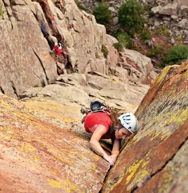 Allison Herrington makes her way up pit Allison Herrington makes her way up pitch five's clean dihedral. Photo by Rob Kepley