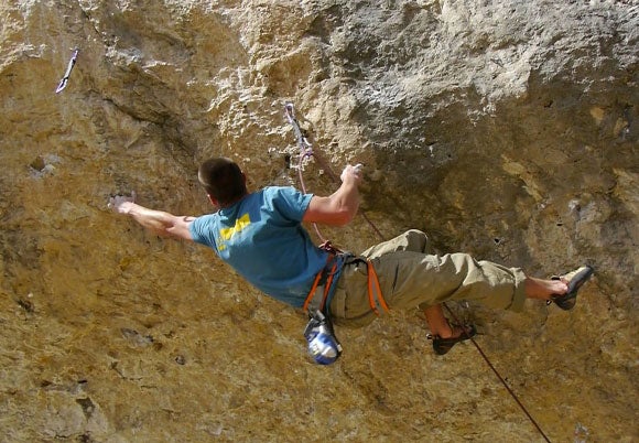 B.J. Tilden climbing through the traver B.J. Tilden climbing through the traverse on Double Down (5.14c). Photo courtesy of Kyle Duba / landerclimbingfilm.com