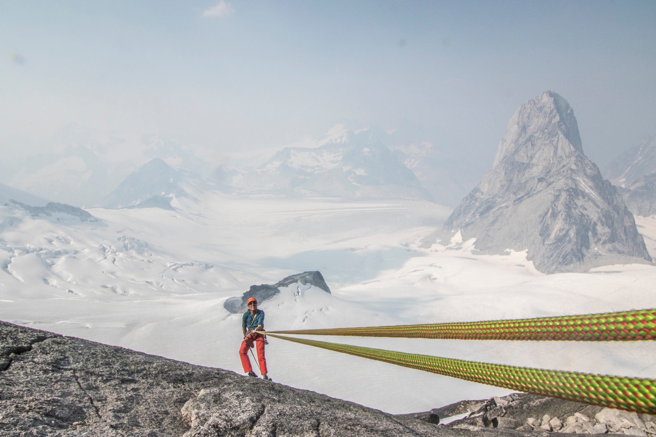 Front view of smiling mountain climber in Bugaboo Mountains, British Columbia, Canada