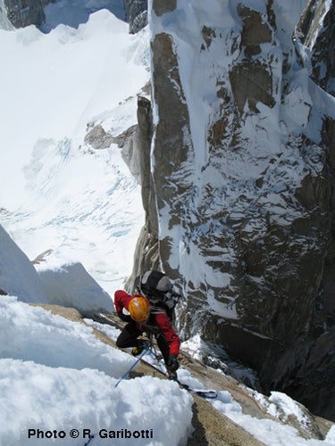 Colin Haley following Spigolo dei Bimbi Colin Haley following Spigolo dei Bimbi on Punta Herron's north ridge in less than ideal conditions during the first day on the traverse. In this…