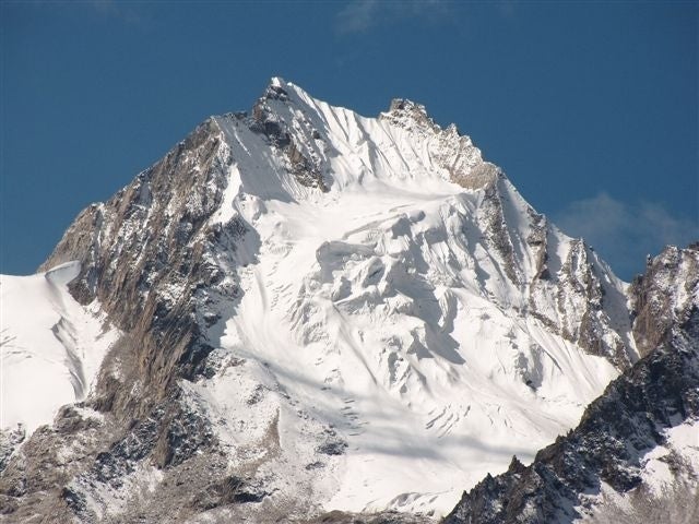 E face of unnamed 6030m on the left ban E face of unnamed 6,030m on the left bank of Aigagong Glacier, Niwu Qu, NE.