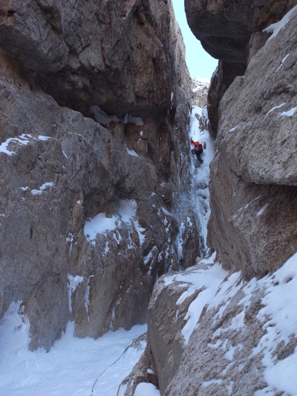 Matt Helliker battles with the crux ove Matt Helliker battles with the crux overhanging chimney pitch of For Whom the Bell Tolls on the north face of Mt. Church. Photo by Jon Bracey