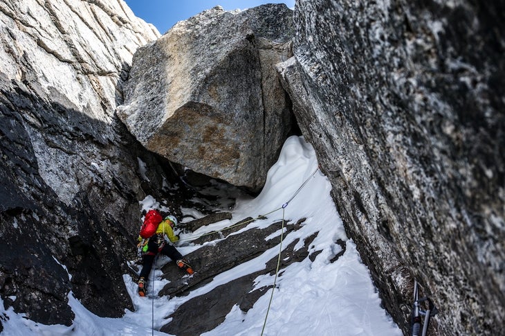 darren below chockstone Darren Vonk below a huge chockstone during the first ascent of Dyke Peak. Photo courtesy of Ian Welsted