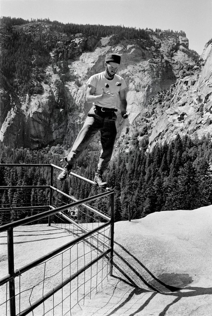 Chuck Pratt training balance by standing one footed on a fence and juggling