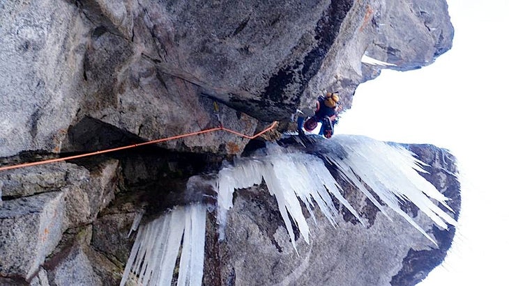 Crux Will Mayo at the top of the crux section of Shooting Star (M9 WI7), a new route on Colorado's Black Wall. Photo by Ben Collett.