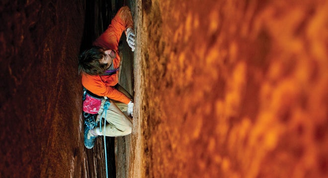 Patrick Kingsbury climbs the aptly named Scream & Slither (5.11) in Long Canyon, Moab, UT.