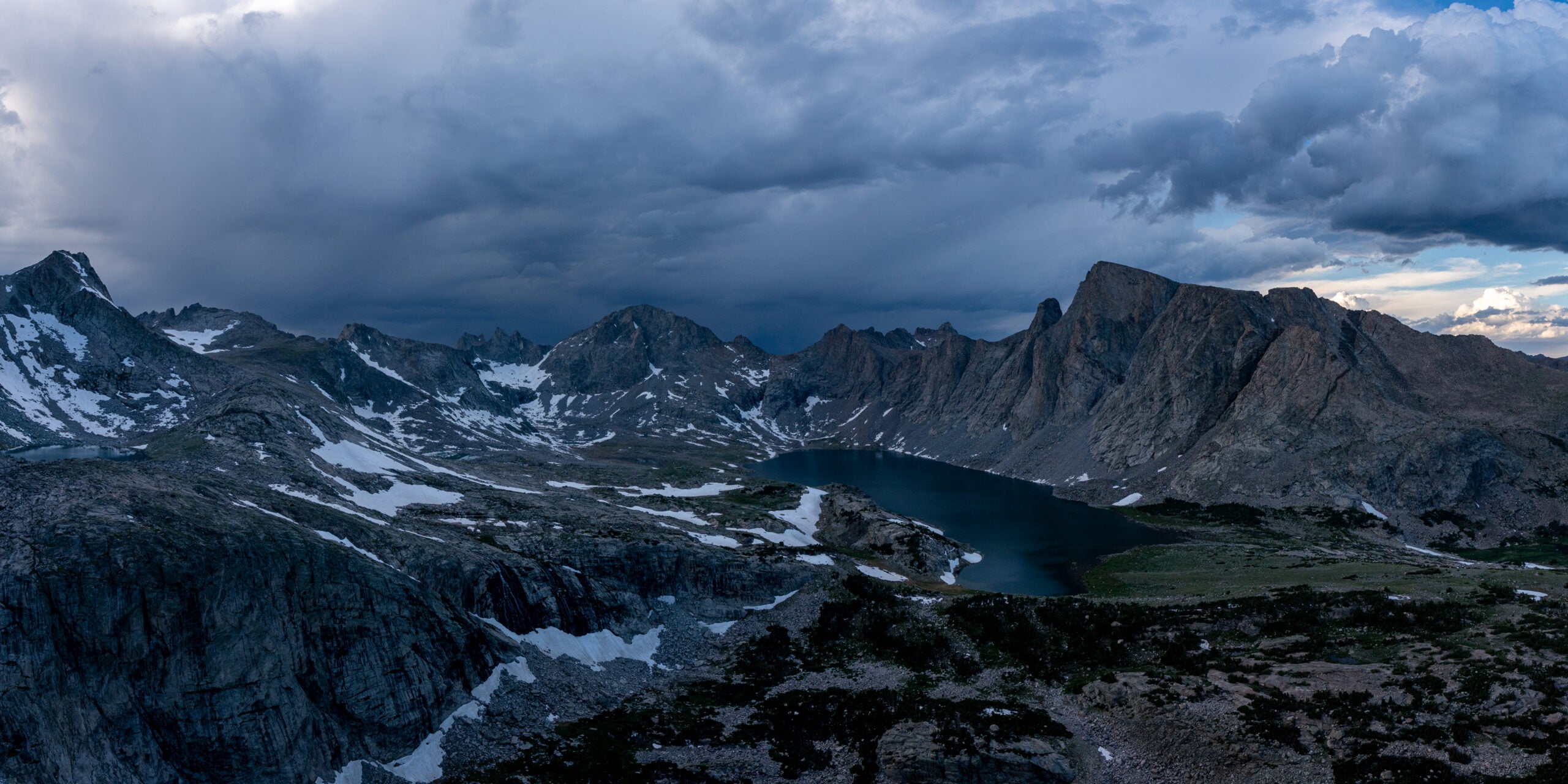 A thunderstorm moving over mountains, as seen from a portaledge on Mount Hooker.