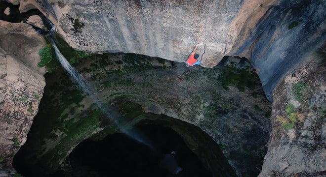 "Video: David Lama Climbs New Route Out of Huge Sink Hole"