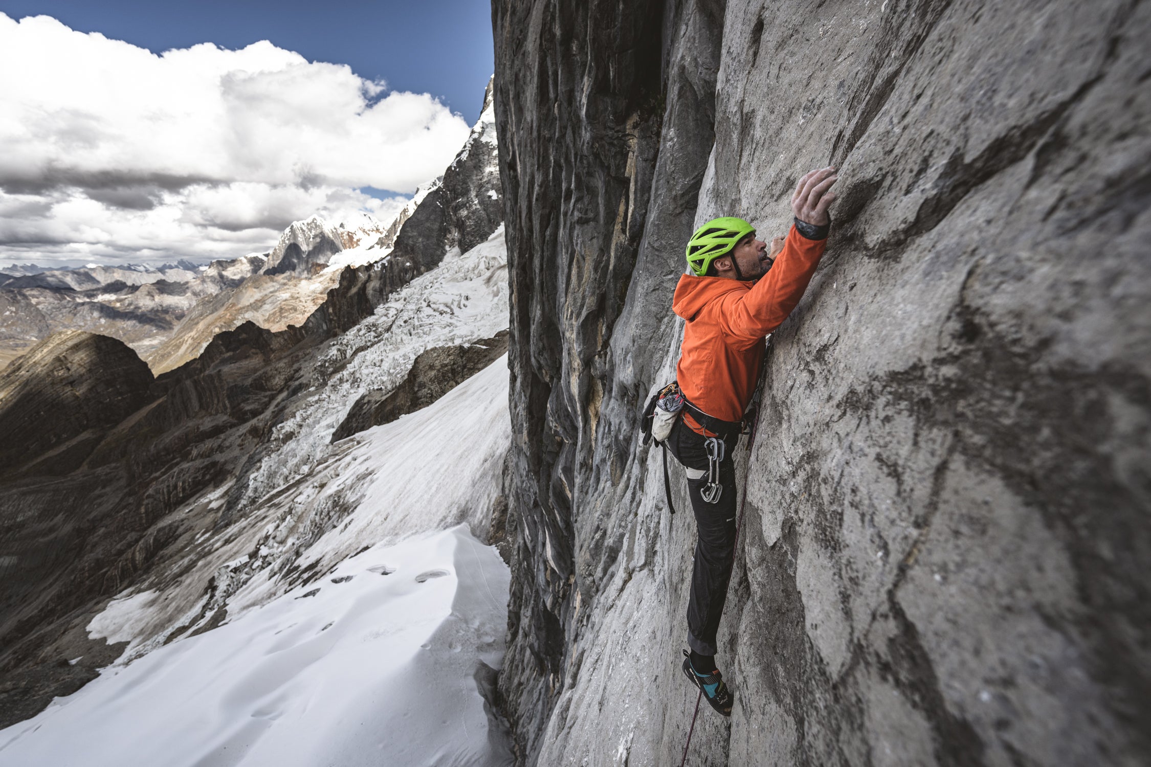 Josh Wharton climbs steep rock in Peru.