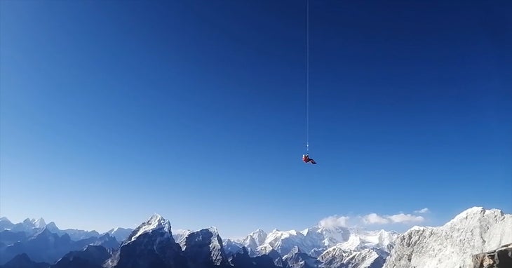 Satyarup_long line rescue_Ama Dablam camp 2_2 A recent long line helicopter rescue from Ama Dablam. The climber is hanging from a 100-foot long-line under a helicopter at 20,000+ feet (6,200…