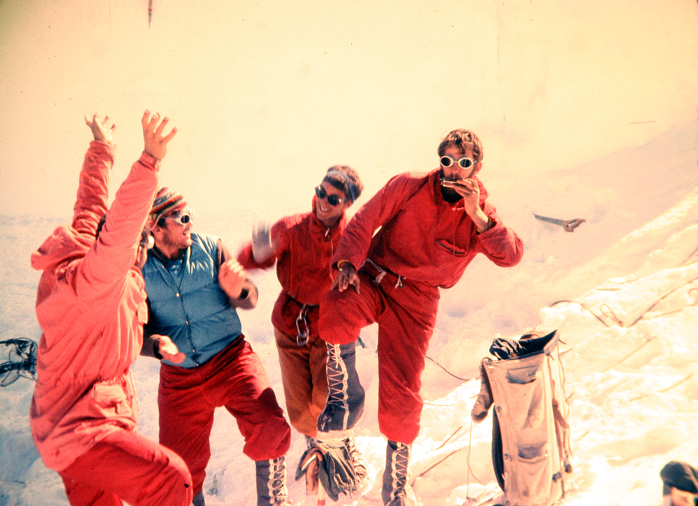 David Roberts (arms up) with Pete Carman, Hank Abrons and Riock Millikan during the first ascent of the Harvard Route on Denali's Wickersham Wall, in 1963. Photo by John Graham