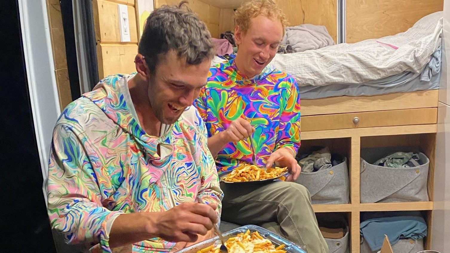 Lance Colley (left) and Tyler Karow celebrating with some baked ziti after setting a new speed record on Sunkit on El Capitan, Yosemite, National Park, California.