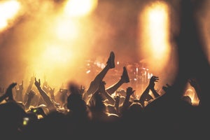 Crowd Surfer Crowd Surfing At Concert Venue Climbing